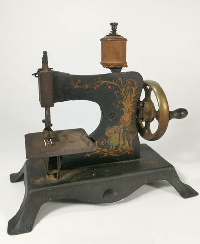 Antique cast iron toy - cast, sewing