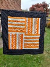Halloween lap quilt, Spooky Moda fabric's, black/orange/white. Hand quilted