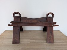 Vintage wooden camel saddle stool. Mid Century Moorish Brass inlay. No cushion.