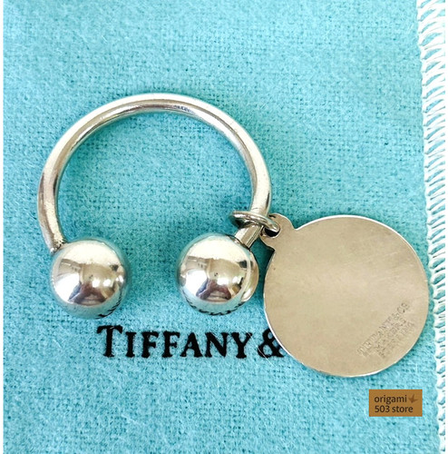 Tiffany return oval tag - to,
