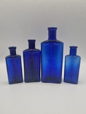 4 Blue Oblong Poison Bottles