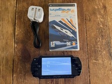 PSP console, new battery, charger and plug