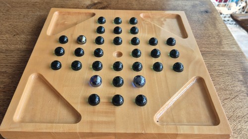 Wooden solitaire with glass