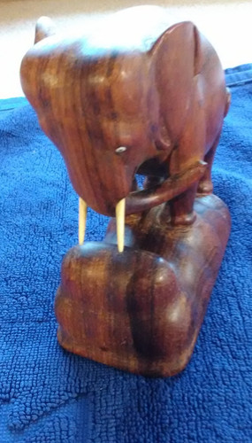 Carved wooden elephant with - wooden,