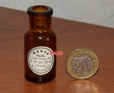 VERY TINY 2 INCHES ANTIQUE  PILLS BOTTLE  -NERVE PILLS SYKES CHEMIST MOLDGREEN