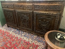 19TH CENTURY GERMAN HEAVILY CARVED LONG SIDE CABINET WITH BAS RELIEF DOORS Old