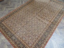 A MAJESTIC OLD MACHINMADE TRADITIONAL ORIENTAL SYNTHETIC RUG (300 x 198 cm)*