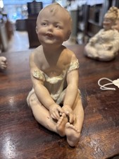 Gebruder Heubach-German Porcelain Bisque-Sitting Piano Baby  4 1/2"