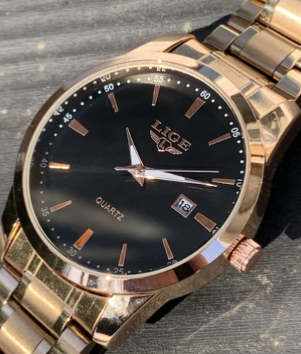 Rose gold watch with dual - watch, tone