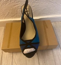 Ladies heeled open toe shoes. Colour are a blend of black, royal and dark blue.