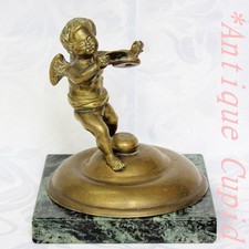 Antique brass winged cherub - brass,