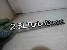 Jeep Cherokee XJ Pre-Facelift tailgate 2.5 turbo diesel metal badge logo