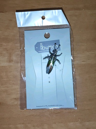 One button beetle brooch - button,