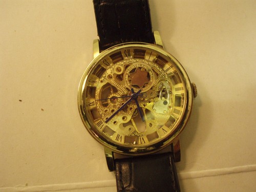 Gold tone skeleton watch - gold,