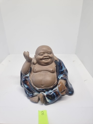 Sitting laughing mudman - sitting,