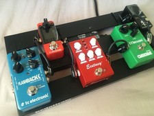 Pedal board with pedals and