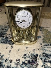 Rhythm Gold Mantel Clock with Rotating Pendulum and Crystals 4SG724WR18