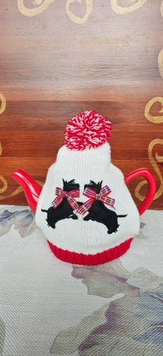 Tea pot and cosy with - tea,