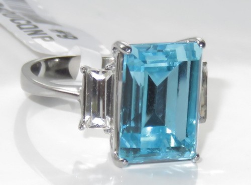 Ladies blue topaz ring three