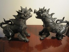 a matched pair of oriental/tibetan hot cast bronze dragons good condition