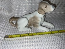 Nao lladro dog lying down - by,