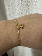 LV Logo Charm On An Adjustable