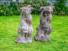 Composite stone cherub statues