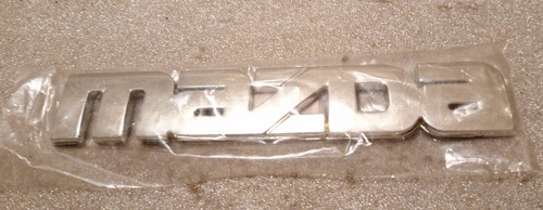 Car badge spells mazda - car,