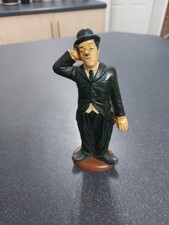 A Ceramic Charlie Chaplin Figure Measures 18cm Tall