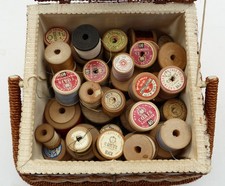 Thirty wooden cotton reels in