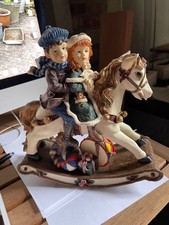 Vintage rocking horse with children christmas decoration.