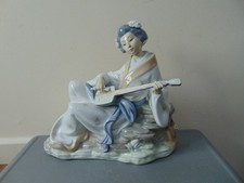 Nao By Lladro 0227. "Oriental Melody". Geisha Playing Shamisen Figurine. A/F