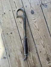 An Antique brass and turned wood handled telescopic salmon fishing gaff