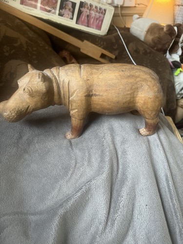Hand carved wooden hippo - hand,