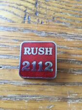 VINTAGE RUSH 212   ENAMEL METAL BADGE RED NEVER BEEN WORN