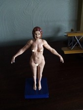 Nude mature lady standing