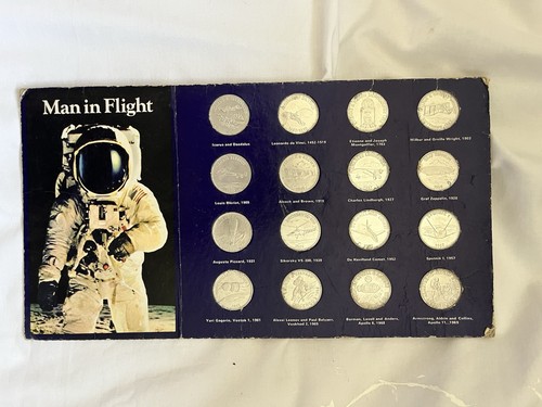 1970s man flight shell coin - flight,