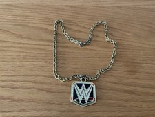WWE UNDISPUTED UNIVERSAL CHAMPIONSHIP PENDANT NECKLACE Fancy Dress?