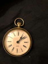Vintage brass battery powered pocket watch style clock in working order