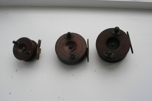 Three wooden fishing reels