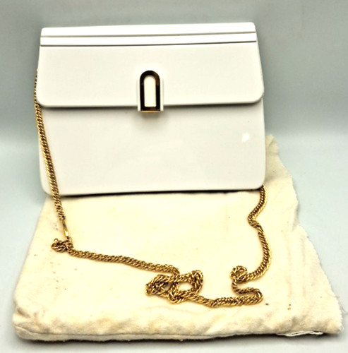 White and gold coloured cross - and,