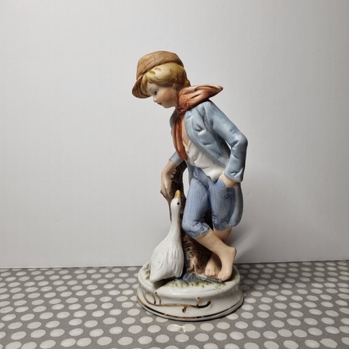 Porcelain figurine boy with - porcelain,