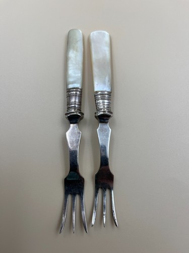 Two antique pickle - , forks.