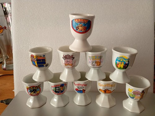 Ten vintage novelty egg cups - x,