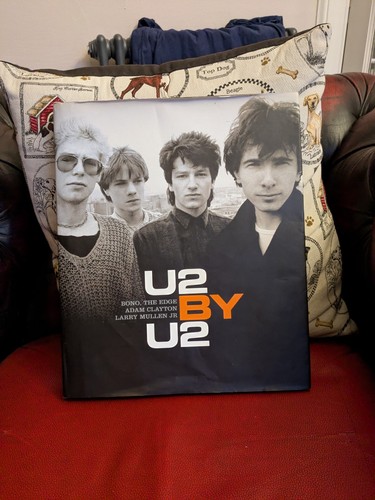 U2 hardback book - by,