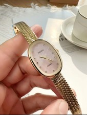 Ladies Gold Pink Bangle Watch