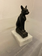 figurine of the ancient Egyptian goddess Bastet, depicted in the form of a cat