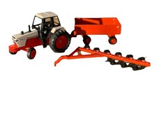 Ertl David Brown  toy tractor with a trailer and plough.Used in great condition 