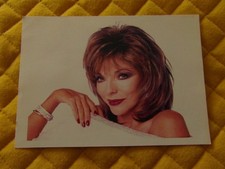 "Joan Collins" photograph signed on the back "with all good wishes"