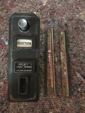 Coin entry & reject button panel from a Jupiter Rustique jukebox